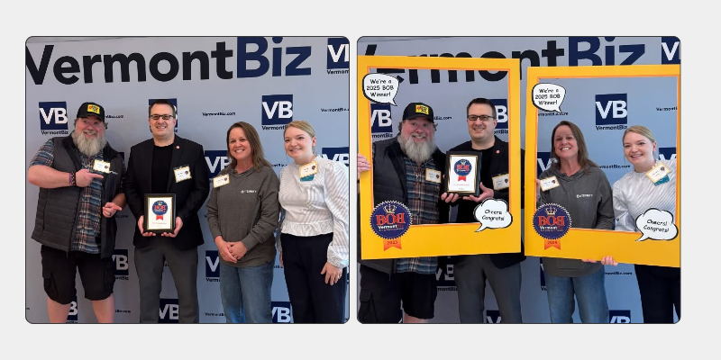 Group posing with an award at a VermontBiz event backdrop